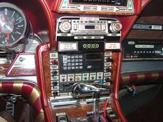 the interior of a car with various electronic devices and gauges on it's dashboard