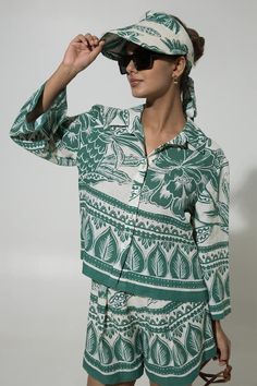 Green linen oversized shirt with floral print. Comes with shorts. - Aza Fashions Green Camp Collar Blouse For Summer, Spring Green Blouse With Camp Collar, Green Camp Collar Blouse For Spring, Summer Floral Print Relaxed Fit Set, Summer Floral Print Set With Relaxed Fit, Green Relaxed Fit Vacation Sets, Green Relaxed Fit Sets For Vacation, Green Floral Print Summer Set, Relaxed Fit Green Blouse For Vacation