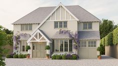 a large white house with lots of windows and plants on the front porch, along with potted flowers