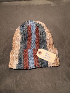 "Beautiful crochet ribbed beanie to keep you warm in the winter months or add some flare to your outfit!  *Shown is Unisex Adult Medium in \"Lakefront\"  color* Sizing:  Unisex small adult: 21-22 inch head circumference  Unisex medium adult: 22-23 inch head circumference  Unisex large adult: 23-24 inch head circumference  These beanies are stretchy due to the ribbed pattern.  Caring for your beanie:  Hand washing is preferred but beanie can be placed in a delicate garment bag and on delicate cyc Casual Winter Hats In Cotton Yarn, Casual Cotton Yarn Winter Hat, Handmade Brown Casual Beanie, Casual Cotton Yarn Crochet Hat For Winter, Casual Cotton Yarn Crochet Beanie, Handmade Casual Brown Beanie, Casual Winter Crochet Hat In Cotton Yarn, Casual Winter Crochet Cotton Hat, Winter Cotton Yarn Crochet Beanie Hat