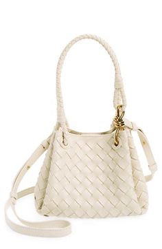 A single intricate knot—a key element of BV's DNA—adds a flash of gleam to this compact bag crafted using the label's signature handwoven intrecciato technique. Magnetic closure Top carry handles; removable, adjustable crossbody strap Leather Made in Italy Designer Handbags Elegant Woven Leather Crossbody Bucket Bag, Carrie Bradshaw Outfits, Fashion 2000s, Bag Obsession, Compact Bag, Woman Bags Handbags, Fabric Gift Bags, Fashion Girl, Sandal Women