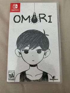 the nintendo wii game omri is on display in front of a white sheet with black ink