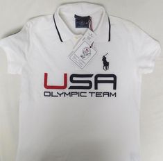 RALPH LAUREN USA OLYMPIC TEAM 2014 WOMEN'S WHITE POLO SHIRT WOMEN'S SIZE - XS PURCHASED AND FORGOTTEN IN THE CLOSET UN-WORN WITH ORIGINAL TAGS RIGHT SLEEVE PATCH: CENTER CHEST EMBROIDERY: USA OLYMPIC TEAM PATCH AND EMBROIDERY SHORT SLEEVE WHITE WITH NAVY BLUE TRIM MEASUREMETS MADE FLAT: SHOULDERS - 14.5" SLEEVE - 5.5" BUST - 16.5" LENGTH - 24" PLEASE SEE ALL PHOTOS CONFIRM MEASUREMENTS NO RETURNS White Short Sleeve Ralph Lauren Polo Shirt, Ralph Lauren White Polo Shirt, Ralph Lauren Fitted White T-shirt, Fitted White Ralph Lauren T-shirt, White Fitted Ralph Lauren T-shirt, Team Usa Olympics, Us Olympics, Usa Olympics, White Polo Shirt