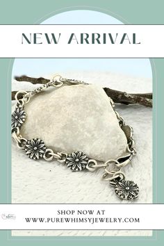 Celebrate nature with the Daisy Chain Silver Bracelet, handmade from Argentium sterling silver and fine silver. This nature-inspired bracelet features dainty daisies, bringing the charm of flowers to your wrist. It has a half-inch of adjustability for a comfortable fit. The simple, elegant design looks great solo or stacked with other bracelets.

Daisies symbolize new beginnings, hope, and joy. They teach us the beauty of resilience and the importance of  finding happiness in small things. Nature-inspired Sterling Silver Bracelet, Nature-inspired Sterling Silver Bracelet Jewelry, Bohemian Sterling Silver Bracelet With Lobster Clasp, Handmade Sterling Silver Spiritual Chain Bracelet, Silver Nature-inspired Bracelet Jewelry, Bohemian Sterling Silver Jubilee Chain Bracelet, Mountain Earrings, Signature Necklace, Jewelry Bracelets Silver