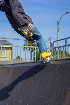 a man riding a skateboard up the side of a ramp