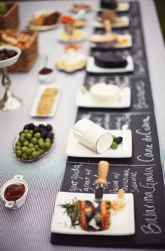 a long table is set up with food and condiments for an event or gathering