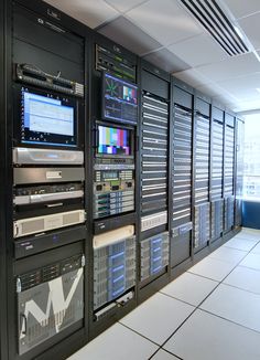 the server room is full of many different types of computers and other electronic equipment on display