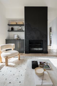 a living room with a fireplace and white carpet