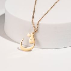 This stunning necklace features a beautifully crafted pendant with a personalized Arabic letter. The elegant design of the letter captures its unique and intricate beauty, making it a focal point of sophistication and charm. The pendant hangs from a delicate chain, perfect for adding a touch of elegance to any outfit. Ideal for everyday wear or special occasions, this necklace makes a meaningful and stylish statement. It also serves as a thoughtful and personalized gift for loved ones, celebrati Elegant Personalized Heart Pendant Chain Necklace, Initial Pendant Name Necklace With Adjustable Chain As Gift, Personalized Pendant Name Necklace, Elegant Personalized Locket Necklace For Mom, Initial Pendant Necklace With Clavicle Chain For Her, Initial Pendant Charm Necklace As Gift For Her, Personalized Initial Pendant Chain Necklace As Gift, Elegant Locket Necklace For Mom With Round Pendant, Elegant Engraved Chain Necklace Gift