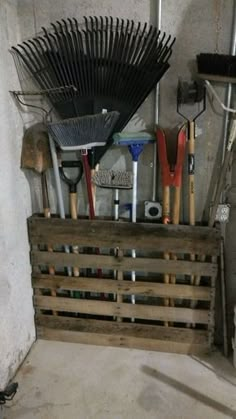 a wooden crate filled with gardening tools