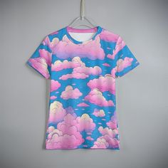 Let your little ones drift into a world of imagination and fun with our delightful Pink Clouds Kids T-Shirt! Perfect for playtime, school days, or just lounging at home, this charming t-shirt is designed to bring joy and comfort to your child's everyday adventures. Features: Whimsical Design: Featuring a cute and dreamy pink cloud pattern, this t-shirt will make your child stand out with its unique and playful style. Classical Round Neck Design: The simple, generous, and fashionable crew neck ad Playful Short Sleeve T-shirt With All Over Print, Playful Pink T-shirt For School, Cute Multicolor Printed T-shirt, Playful Multicolor All Over Print Top, Playful Multicolor Printed T-shirt, Multicolor Kawaii Tops With Letter Print, Playful Cartoon Print Crew Neck T-shirt, Playful Crew Neck T-shirt With Cartoon Print, Playful T-shirt With All Over Print And Short Sleeves