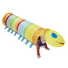 a little boy that is laying down in a caterpillar