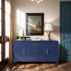 a blue cabinet in the corner of a room with a painting on the wall above it