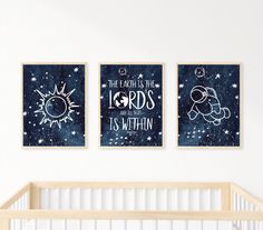 two posters on the wall above a crib in a baby's nursery room