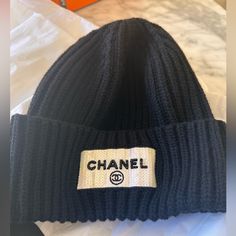 Gorgeous Black Beanie New Never Used Has A White Banner In Sequence On The Front New Never Used Came With Chanel Paper Only 100000% Authentic Black Beanie Hat, White Banner, Chanel Hat, Black Beanie, Chanel Black, Hat Cap, Beanie Hat, Beanie Hats, Chanel