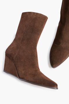 Step out in style with the Dark Brown Suede Gwyneth Wedge Boots! A founder favorite, this classic silhouette has fun details with a wedge heel for comfort and soft, flexible suede for added flair. Sure to be your grab-and-go shoe all season long, pair with jeans by day and pair back to your favorite maxi dress by night. Ankle boot Pointed toe Wedge heel Hidden interior zipper Soft, flexible suede Material: Material: Suede Textile Upper, Synthetic Outsole Care: Spot treat with damp cloth Suede Material, Wedge Boots, Classic Silhouette, Brown Suede, You Bag, Wedge Heels, Dark Brown, Ankle Boot, Wedges