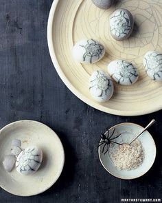 several bowls and spoons filled with powdered sugar