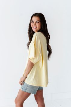 Features Round Neck Short Sleeves Pastel Yellow Color 100% Cotton Size + Fit Small 0-4, Medium 4-8, Large 8-12 Kristin is 5'4", a size 1 and is wearing a Small Oversized fit, size down if you want less oversized. Above recommendation is for an oversized fit. Click here for shorts in photos Click here for shorts in Aimee's try on video