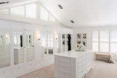 a large white room with lots of closets