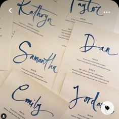 six different types of calligraphy written on white paper with blue ink in the middle