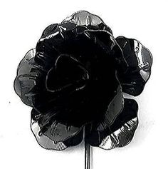 a black lapel flower on a white background