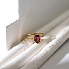 - 14k gold - Center stone: Oval Cut 5 x 7 mm Pink Tourmaline - 1 mm band width Please note: If you require a size that is not available email us at hello@midafinejewelry.com to inquire. Thank you! Minimalist Oval Ruby Ring In Yellow Gold, Minimalist Oval Yellow Gold Ruby Ring, Minimalist 14k Gold Oval Ruby Ring, Dainty Oval Ruby Ring In 14k Gold, Pink Tourmaline Ring, Tourmaline Jewelry, Oval Rings, Tourmaline Ring, Pink Ring