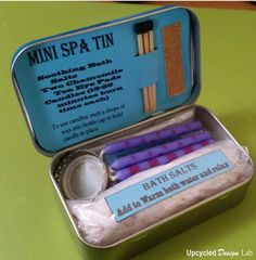 an open tin with some toothbrushes in it