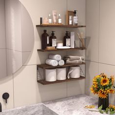 a bathroom with sunflowers and towels on the shelf