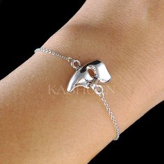 "PERFECT CHRISTMAS GIFT FOR LADIES!! You are getting a dainty, Phantom of the Opera Half Mask Bracelet attached to fine cable original rhodium plated chain. Charm size is 1/2\" wide X 11/16\" high (12mm X 17mm) Color : Silver The bracelet measures 6 1/2\" long (16.5cm) with 2\" extension chain (5cm). Prices are in US$. For shipping policies and other important information, click on \"profile\" on the right. See an item that you like but has already been sold? Contact me to see if I have more! Th Silver Bracelets For Party, Silver Bracelets For Party As A Gift, Silver Bracelets For Party Or Gift, Silver Bracelets For Party, Great As Gifts, Phantom Of The Opera Masquerade, Christmas Best Friend, Animation Tools, Broadway Plays, The Phantom Of The Opera