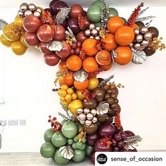 an art piece made out of balloons and flowers