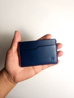 The Slim Wallet is one the most simplistic wallet styles offered. It features three pockets, two on the outside that allow for easy access to cards and one in the middle for stashing cash or more cards. Material: Full-Grain American Leather Dimensions: 3.8in x 2.80in Holds 4-6 cards and some bills. Handcrafted in Alabama, USA -Because leather is an organic material, there will be variations in color & texture from piece to piece. Rectangular Card Holder With Pockets For Daily Use, Rectangular Card Holder For Daily Use, Rectangular Trifold Wallet With Flat Pocket For Daily Use, Rectangular Trifold Wallet For Daily Use, Daily Use Rectangular Trifold Wallet With Flat Pocket, Daily Rectangular Trifold Wallet With Flat Pocket, Rfid Blocking Rectangular Trifold Wallet, Blue Card Holder With Card Slots, Blue Card Holder With Card Slots For Personal Use