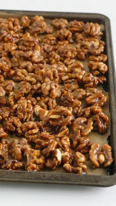 a tray filled with nuts sitting on top of a table