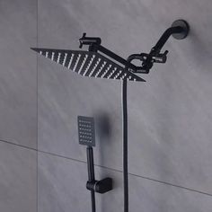 a shower head with thermostaer and hand held shower faucet attached to it