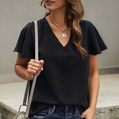 The Perfect Lil Black Flutter Sleeve Blouse. V-Neck, Short Sleeve And Easily Dresses Up Or Down Butterfly Sleeve Tops For Workwear, Butterfly Sleeve Tops For Work, Chic Black Long Sleeve V-neck Top, Black V-neck Summer Blouse, Black V-neck Top For Spring, Black Ruffle Sleeve Top For Work, Black Ruffle Sleeve Blouse For Work, Black V-neck Office Blouse, Black V-neck Blouse For Office