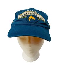 This Vintage Hat from Bitterroot River Montana Freestone Fly Shop is a stylish blue baseball cap. It's unisex and has an adjustable size for a perfect fit.  * Blue, vintage-style baseball cap * From Bitterroot River Montana Freestone Fly Shop * Unisex design * Adjustable size for a perfect fit * Buckle closure * Embroidered Features: * Base Bal Hat Size: Adjustable Condition: Pre-Owned Good Blue Dad Hat For Outdoor, Blue Dad Hat For Outdoor, One Size, Blue Sports Bucket Hat, Blue Fitted Hat For Outdoor, One Size, Blue Bucket Hat For Sports, Blue Outdoor Dad Hat - One Size Fits Most, Blue Sports Hat With Short Brim, Blue Baseball Cap With Visor For Outdoor Activities, Blue Fitted Baseball Cap For Outdoor