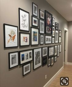 a wall with many pictures on it