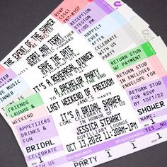 some tickets are sitting on top of each other for a concert or show that is going on