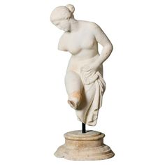 A white statuary marble sculpture of the bathing Venus after the antique, sourced from the estate of the late David Cornwell, best known at the author John le Carré. Dating to circa 1840, this Italian sculpture of Venus is mounted onto a custom modern stand in a fragmentary form. A striking Roman sculpture evoking evocative hand-carved elements, from her hair to her drape. An elegant segment of history made for any period home looking to appreciate 16th century history. The Bathing Venus The ori Statuary Marble, Italian Sculpture, White Sculpture, Period Home, Roman Sculpture, Marble Sculpture, Body Reference, Neoclassical, 16th Century