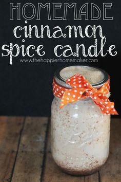 homemade cinnamon spice candle in a mason jar with polka dot bow on the top and text overlay that reads homemade cinnamon spice candle