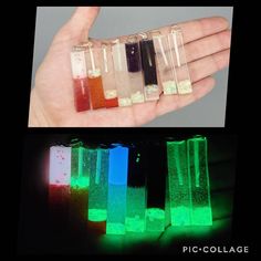 glow in the dark bottles filled with liquid and ice cubes are being held by a person's hand