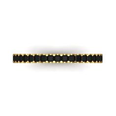 a gold and black beaded ring on a white background