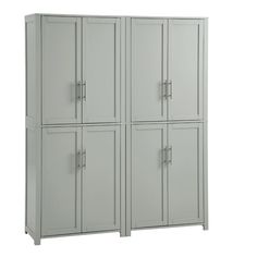 two tall gray cabinets sitting next to each other