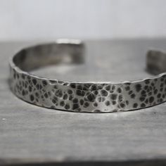 This custom cuff bracelet from men is created from high quality sterling silver metal. ♥ 3/8" Wide by 6" long ♥ Hand hammered ♥ Oxidized for darkness ♥ .925 Sterling Silver To order yours, choose your options & enter your personalized details to the box. Add it to your cart. Choose your shipping method, and check out.  ●-●SIZING - PLEASE FOLLOW THE INSTRUCTIONS CAREFULLY SO YOU ORDER THE CORRECT SIZE●-● ●-●A RESIZING FEE OF $10 WILL BE CHARGED FOR ALL PRECIOUS METAL CUFFS●-● The best way to know Silver Cuff Jewelry For Father's Day, Custom Cuff Bracelet, Bracelet For Men, Hand Made Jewelry, Silver Cuff, Silver Man, Last Minute Gifts, Precious Metals, Bracelets For Men