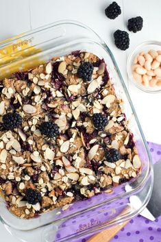 a glass baking dish filled with fruit and nuts