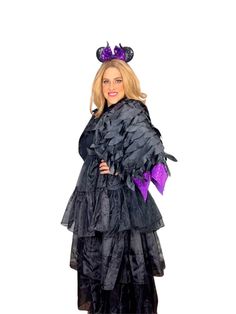 a woman wearing a black and purple costume