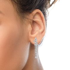 Drape yourself in the exquisite sparkle of these diamond waterfall earrings! A perfect statement piece for day or night, these dangle drop earrings are simply splendid in an array of round white diamonds of 3.15 total cttw in an approximate H-I color and VS1-VS2 clarity. These bezel-set diamonds hang elegantly from your ears, making them sparkle in the light as the diamonds descend in a glistening cascade. Each bezel setting is finished with delicate milgrain work on the edges. These unique earr Waterfall Earrings, Cluster Design, Geometric Inspiration, Bezel Set Diamond, Cluster Earrings, Diamond Cluster, White Diamonds, Unique Earrings, Diamond White