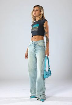 DESCRIPTIONThe hottest trend in denim for this season! The oversized jean features a cross waistband and baggy pant is now available in our vintage-inspired Seattle Blue wash. Model is wearing size 25 DETAILSFront Rise: 11 3/4”Leg Opening: 21”Inseam: 33 1/2“100% Cotton Denim CRAFTED BY HAND, JUST FOR YOU. Cargo Jumpsuit, Oversized Jeans, Baggy Pant, Denim Crafts, Jeans Size Chart, Premium Denim, Hottest Trends, The Body Shop, 70s Fashion