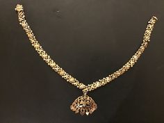 This is a Sri Lankan Vintage Silver Gold Plated Necklace. From the origin of Sri Lanka , this valuable necklace is probably from the capital city of Kandy. The screw is missing and can be replaced with a cord or other screw. It is a well sized choker necklace good for all events and wearing. It also has a nice bird design which is elegant and beautiful. This necklace is 32.7 grams The necklace is 35cm in length end to end. Sri Lankan Jewelry, Swan Necklace, Kandy, Screw It, Gold Plated Necklace, Bird Design, Capital City, Gold Jewellery, Wedding Necklace