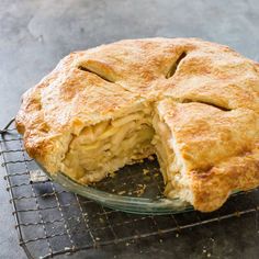 a pie that has been cut in half on a cooling rack