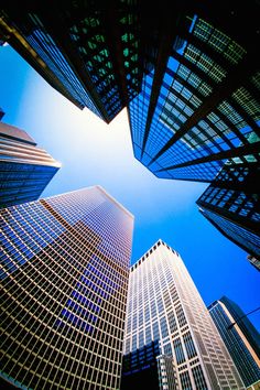 looking up at skyscrapers from the ground